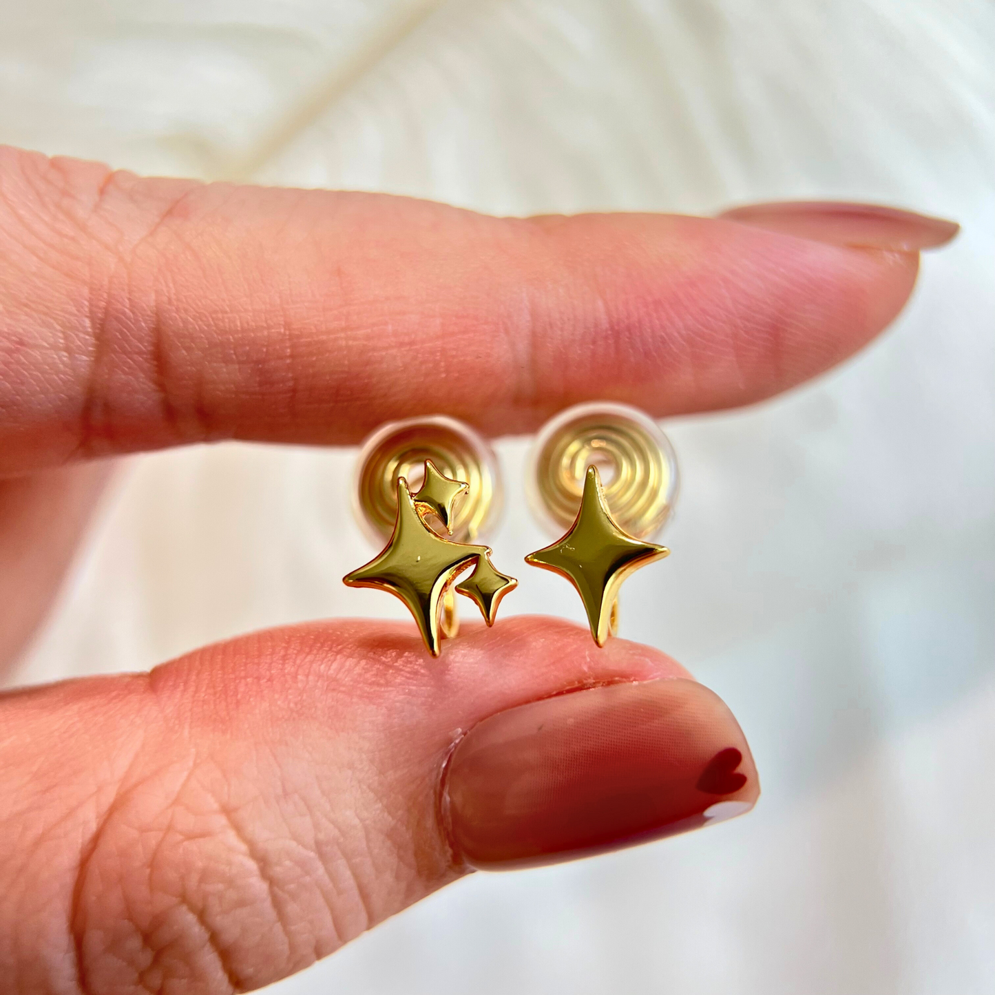 Gold Mismatched Star Clip On Earrings