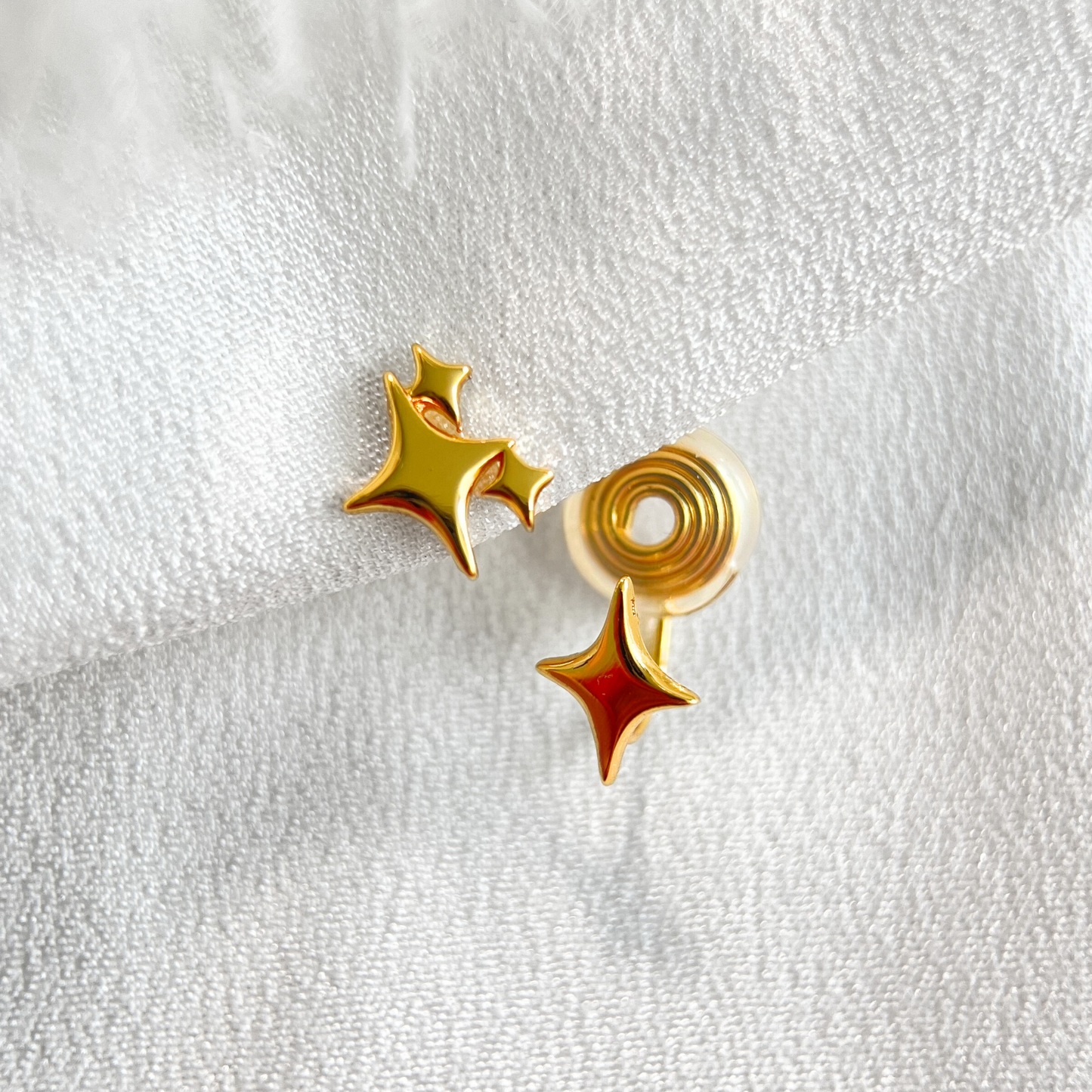 Gold Mismatched Star Clip On Earrings